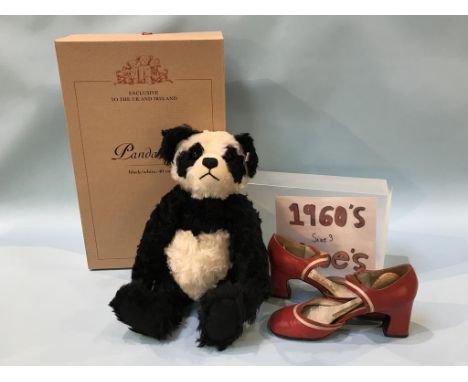 A boxed Steiff Panda bear and a pair of Meteor shoes