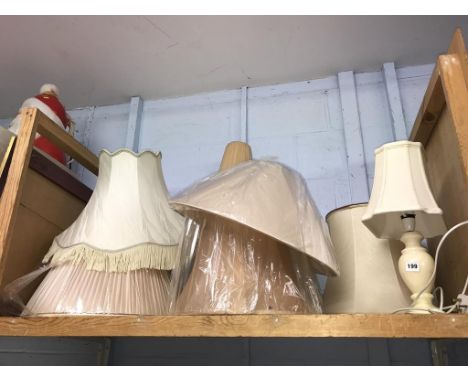 A quantity of lampshades and a lamp