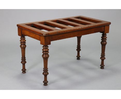 A Victorian mahogany luggage stand by James Shoolbred &amp; Co., on turned tapering legs, 28” wide x 16¾” high x 16” deep, wi