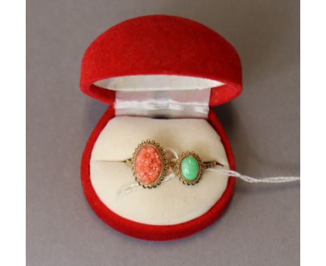 A 9ct. gold ring set oval coral carved with flowers; size: P, weight: 2.6 gm; &amp; another set oval jade; size: O, weight: 1