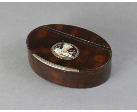 A Georgian lacquer-decorated oval snuff box inset harvest-scene roundel to the hinged lid, with engraved white-metal mounts, 