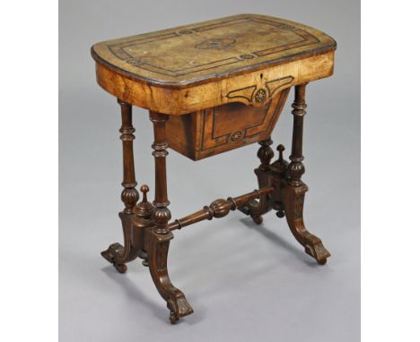 A Victorian burr-walnut inlaid needlework table with rectangular hinged top enclosing a fitted interior, on turned &amp; carv