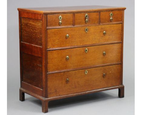 An 18th century oak chest with moulded edge to the rectangular top &amp; fielded panel sides, fitted three short &amp; three 