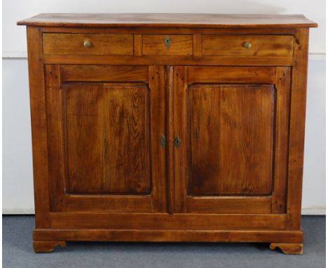 A 19th century French cabinet, possibly chestnut, with plain rectangular top, fitted three frieze drawers with brass knob han