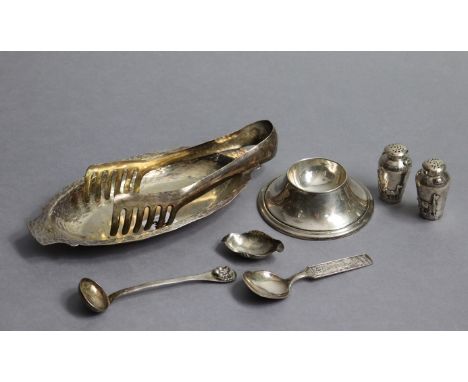 A Peruvian sterling circular salt cellar with wide base, 4½” dia.; a ditto pair of small pepper pots; a ditto small ladle; a 