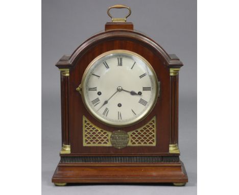 An Edwardian bracket clock in mahogany &amp; brass architectural case with presentation plaque, the 6¾” silvered dial with ro