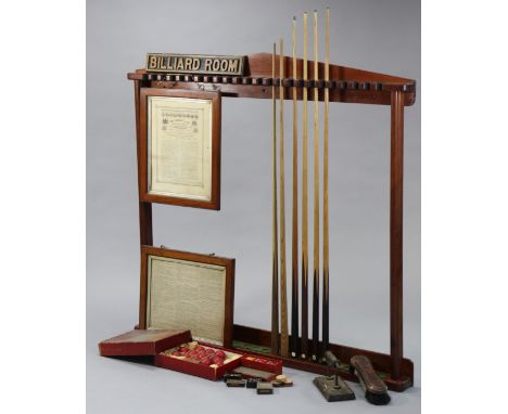 A COLLECTION OF EARLY 20thC SNOOKER &amp; BILLIARDS ACCESSORIES, to include a mahogany cue-rack, 56” wide x 52” high, six vin