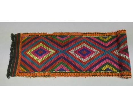 A Suzni kilim runner with repeating multi-coloured geometric design, 28” wide x 120” long.