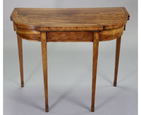 A regency inlaid mahogany card table inset green baize to the fold-over top, on square tapered legs, 36” wide x 29¼” high x 1