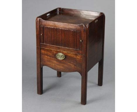 A George III figured mahogany night commode with pierced side handles to the tray-top, tambour shutter, ceramic pull-out comp