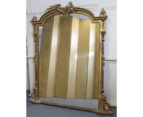 AN EARLY VICTORIAN GILTWOOD &amp; EBONISED OVERMANTEL MIRROR, the shaped architectural cornice with central torch-&amp;-husk 