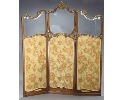 A French walnut &amp; parcel-gilt three-fold draught screen, each section inset with a bevelled glass pane above a needlework