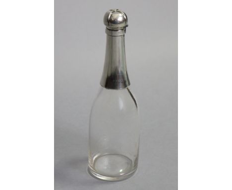 A LATE VICTORIAN SILVER-MOUNTED GLASS NOVELTY DECANTER, in the form of a champagne bottle, with hinged silver cover shaped as