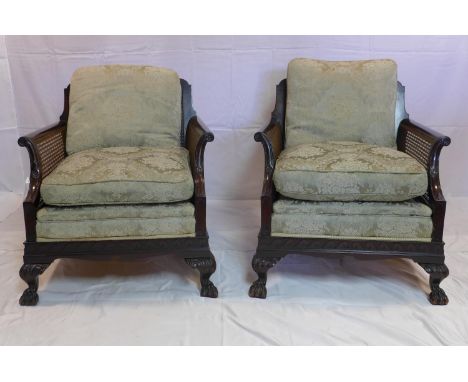 A pair of Edwardian mahogany bergere armchairs in the Chippendale manner 