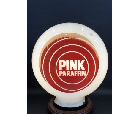 A Pink Paraffin glass petrol pump globe by Hailware, damage to neck.