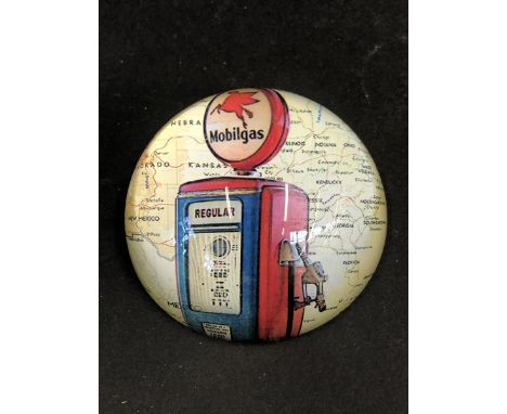 A decorative paperweight, with an image of a Mobilgas petrol pump and globe.