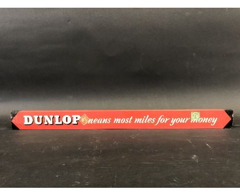 A Dunlop 'means most miles for your money' shelf strip.