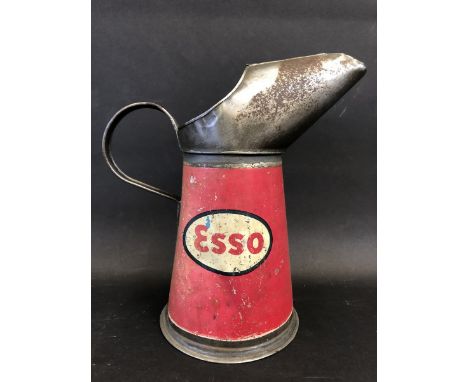 An Esso quart oil measure. 