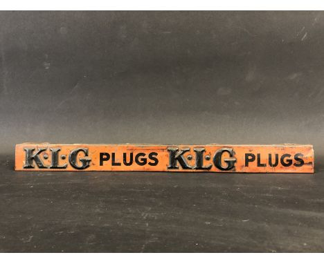 An early and rarely seen K.L.G. Plugs embossed shelf strip. 