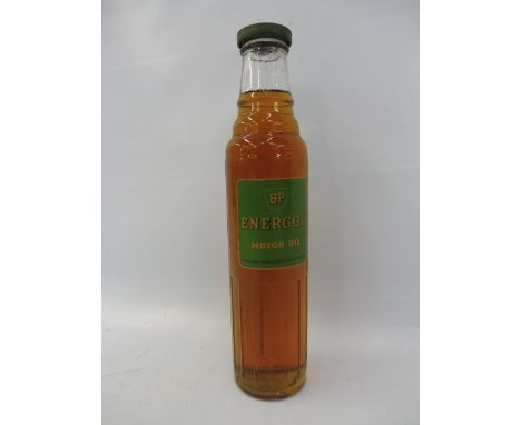 A BP Energol Motor Oil glass bottle with contents.