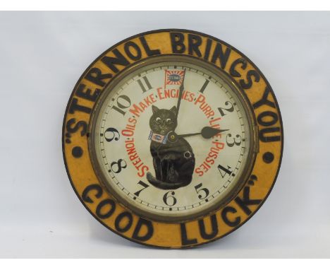 A rare Sternol Oils circular wooden advertising wall clock, with original painted dial depicting their 'cat' figure, 16 1/2" 