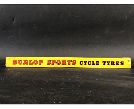 A Dunlop Sports Cycle Tyres shelf strip. 