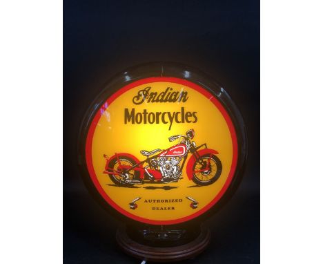 A contemporary decorative plastic globe advertising Indian Motorcycles.