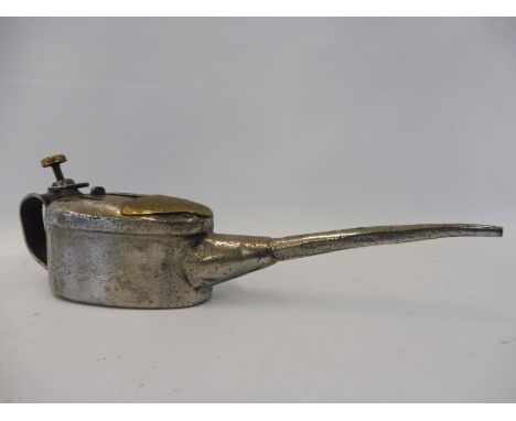 A half pint oiler bearing brass plaque 'As recommended Duckhams new process oil No.4 for engine'.