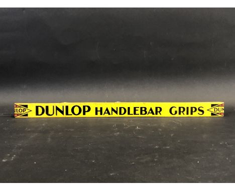 A Dunlop Handlebar Grips shelf strip in good condition.