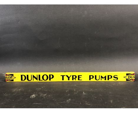 A Dunlop Tyre Pumps shelf strip in good condition.