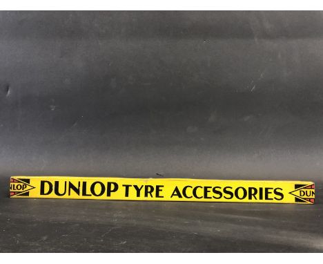 A Dunlop Tyre Accessories shelf strip. 