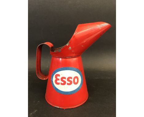 A pint oil measure with Esso labels to either side. 