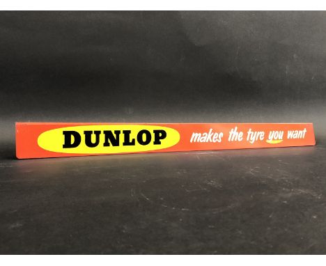 A Dunlop 'makes the tyre you want' shelf strip in excellent condition.