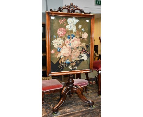 A Victorian rosewood firescreen, 57cm by 122cm