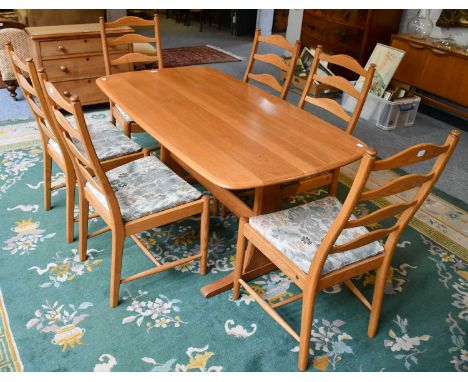 A light Ercol refectory dining table, 152cm by 83cm by 72cm, and set of six matching ladder back chairs; together with an Erc