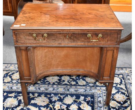 A Chippendale style mahogany writing table of unusual form, the moulded rectangular top over a single drawer opening to revea