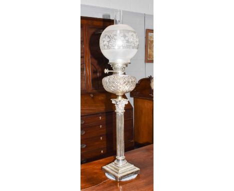 A silver plated Corinthian column oil lampBurner mechanism in good condition, reservoir free from chips and crack, heavy wear