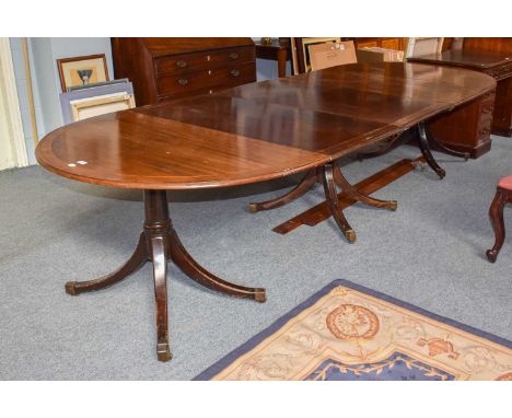 A 19th century inlaid mahogany triple pillar dining table, with three additional leaves (a.f.), 325cm by 124cm by 72cmTwo end