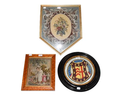 A silk embroidered crest 'Clare Coll. Cambridge' in a Victorian circular ebonised frame, a framed wool tapestry picture of a 