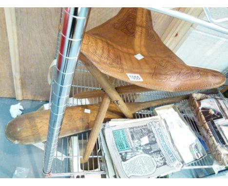 WOODEN PADDLE. Wooden paddle and a leather three legged stool