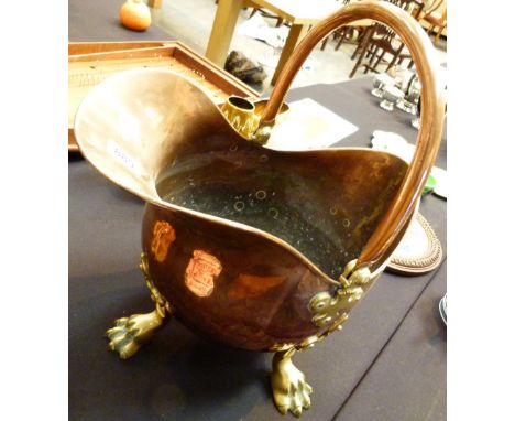 COAL SCUTTLE. Brass and Copper helmet coal scuttle with claw feet H:47 cm