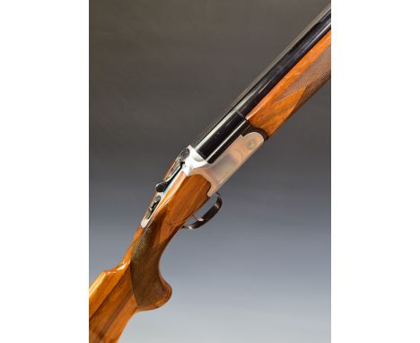 Fabarm SPA Gamma 12 bore over and under ejector shotgun with engraved locks, underside and thumb lever, chequered semi-pistol