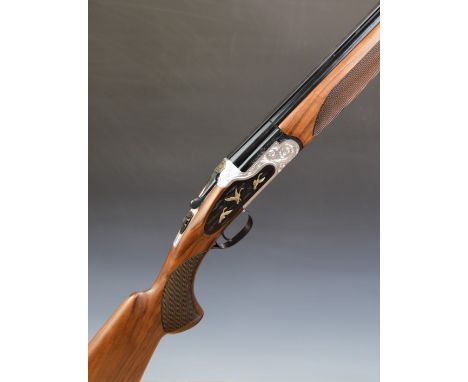 Huglu 103 FE 20 bore over and under ejector shotgun with engraved and gilt scenes of birds to the sidelock plates, scrolling 