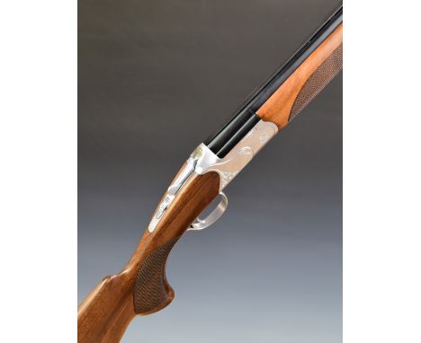 Huglu 103 DE 20 bore over and under ejector shotgun with engraved locks, underside, trigger guard, top plate and thumb lever,