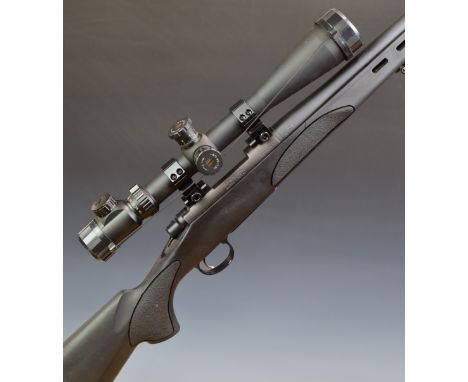 Remington Model 700 LH .223 REM bolt-action rifle with textured semi-pistol grip, sling mounts, bi-pod, ZOS 10-40x50 SFE scop