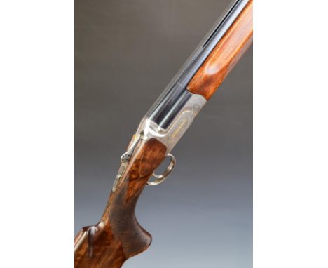 Perazzi MX2000&nbsp;12 bore over and under ejector shotgun with engraved lock, underside, trigger guard and thumb lever, gold