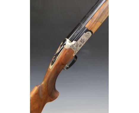 Pointer 612 S 12 bore over and under ejector shotgun with engraved scenes of birds and dogs to the locks and underside, chequ