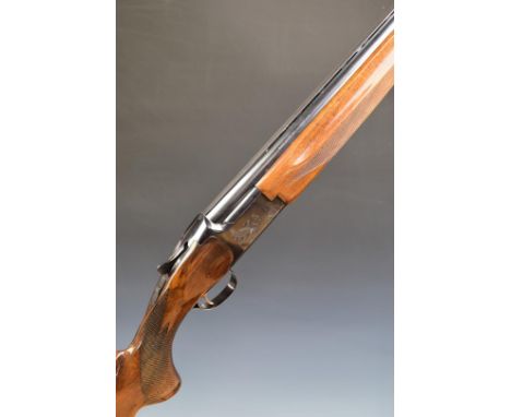 Miroku 12 bore over and under ejector shotgun&nbsp;with engraved locks, chequered semi-pistol grip and forend, single trigger