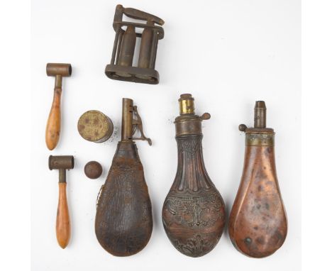 Seven gun and shooting related items items comprising a G &amp; JW Hawksley powder flask with embossed decoration, Sykes powd