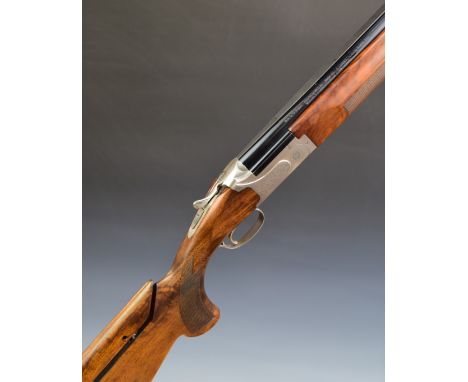 Winchester Select Trap&nbsp;12 bore over and under ejector shotgun with engraved locks and thumb lever, chequered semi-pistol